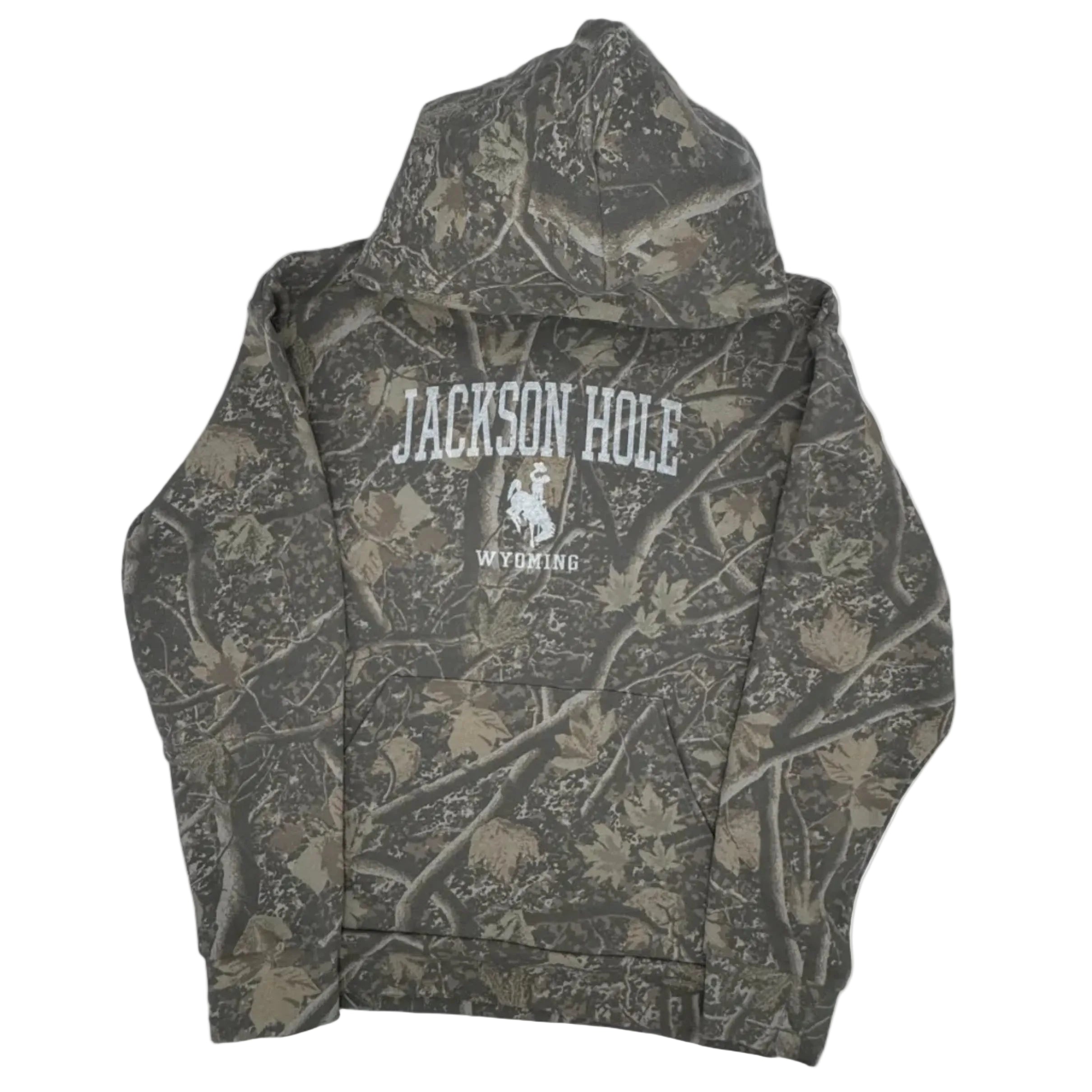Camouflage-patterned hoodie with branding inside a gray bag on a white background